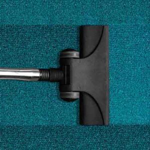Teppich und Staubsauger